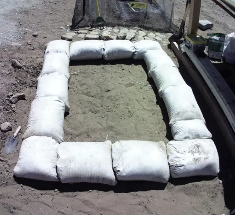 First course of bags laid and tamped